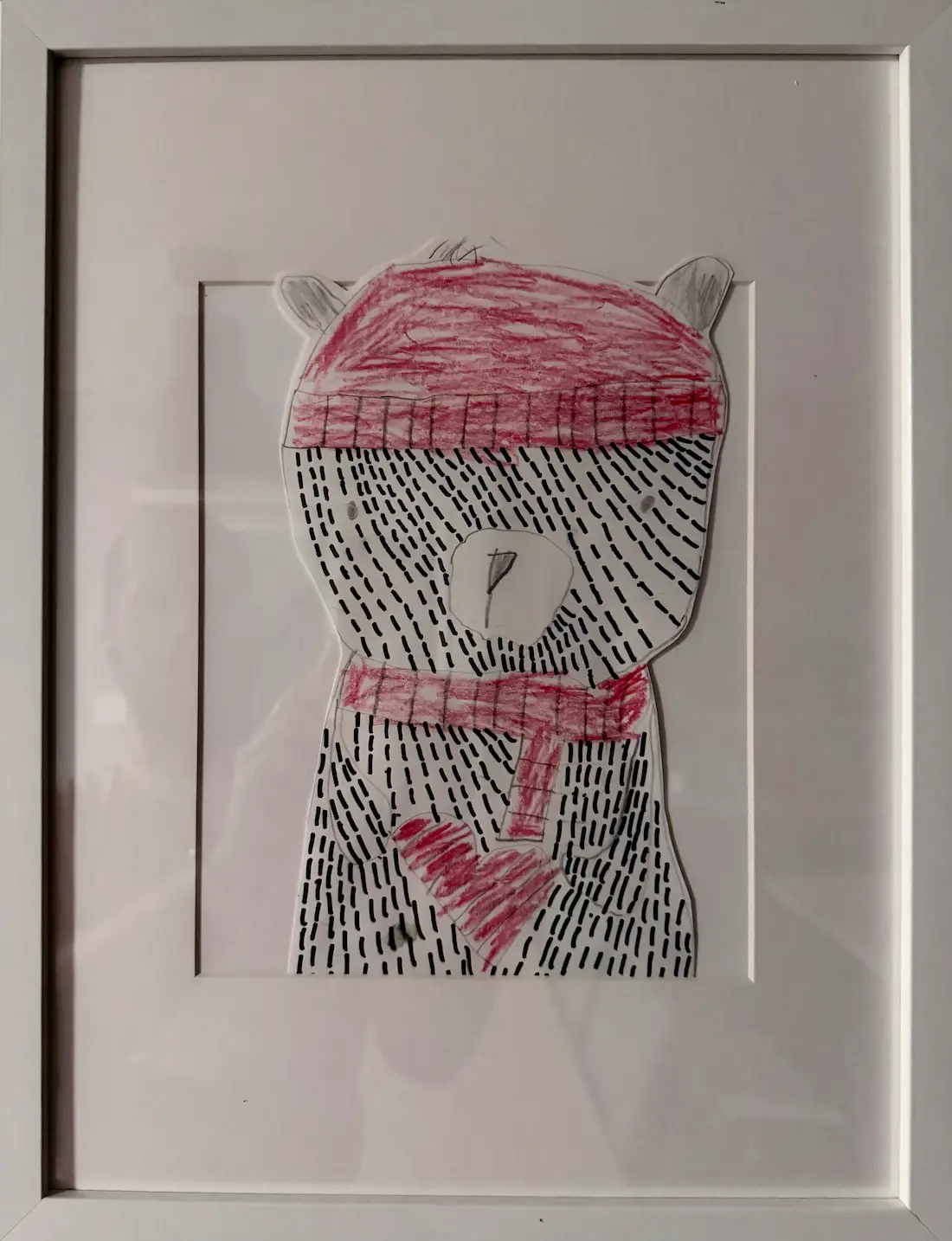 A matted picture of an art project my oldest son made in first grade.